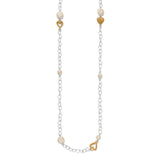 Necklace with heart-shaped gold charms and pearl beads on a white background