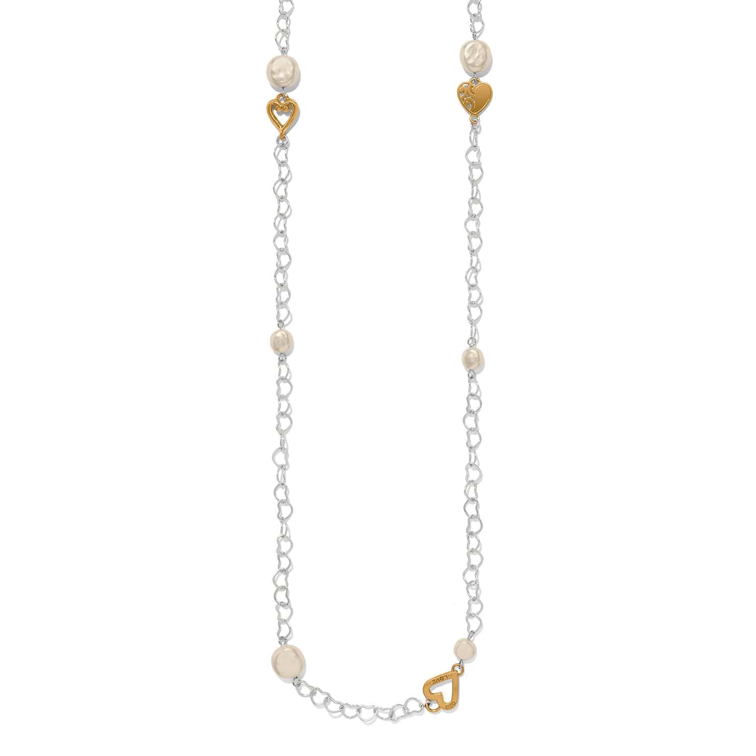 Necklace with heart-shaped gold charms and pearl beads on a white background