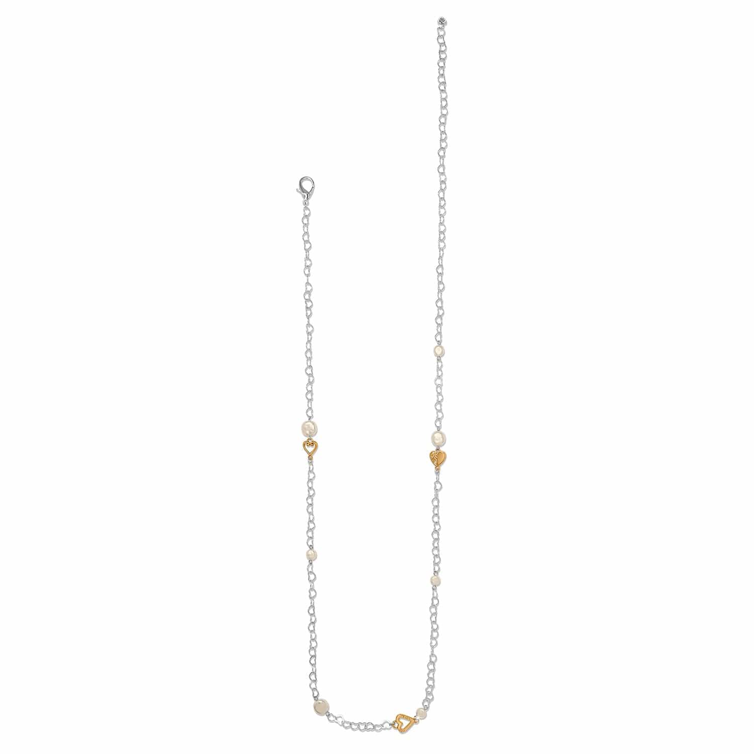 Delicate necklace with small heart-shaped pendants on a white background