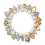 Bracelet with heart-shaped charms and pearls on a white background