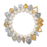 Bracelet with heart-shaped charms and pearls on a white background