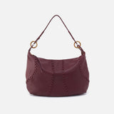 Maroon handbag with gold accents on a white background