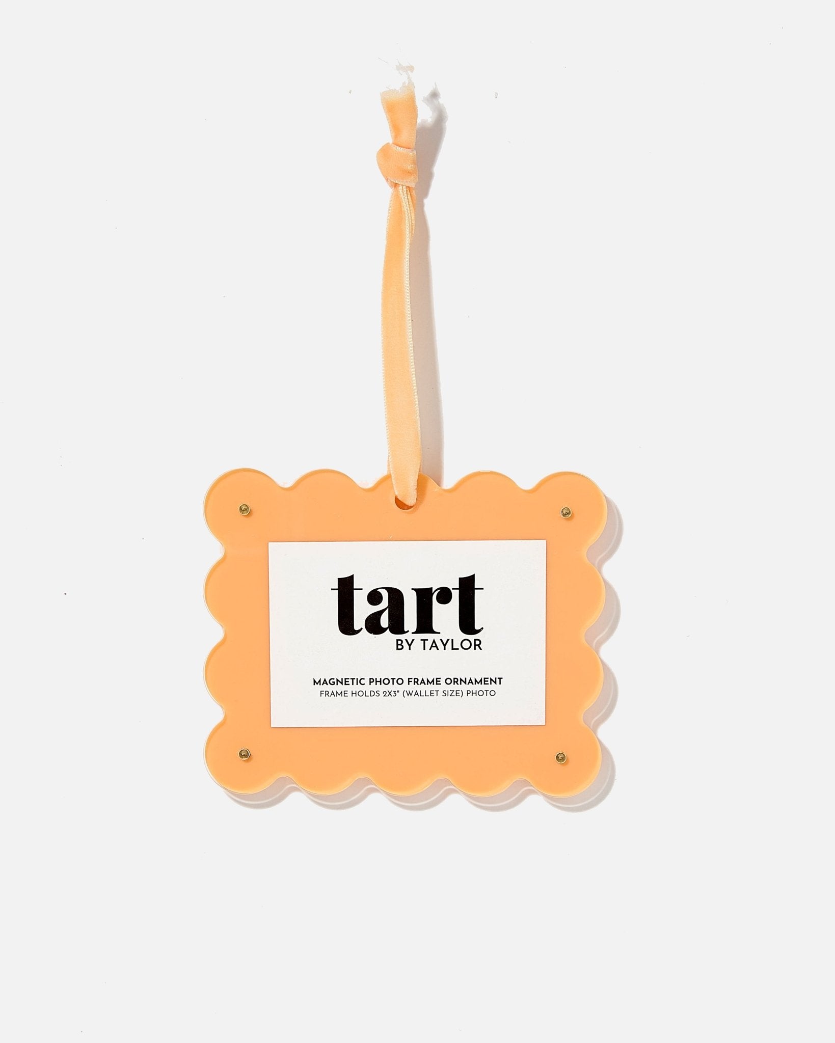 Orange photo frame ornament with 'tart by taylor' branding on a white background