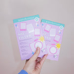 Two packages of 'No Filter' face masks held by a hand against a plain background