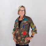 Person wearing a colorful jacket with a white background