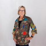 Person wearing a colorful jacket with a white background