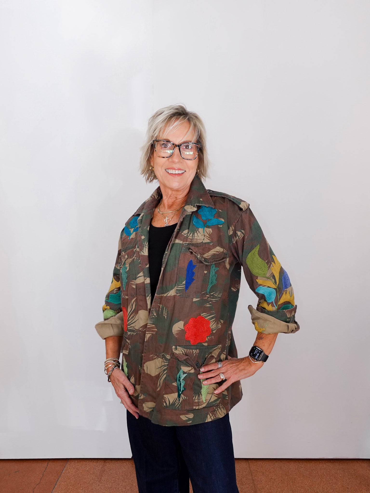 Person wearing a colorful jacket with a white background