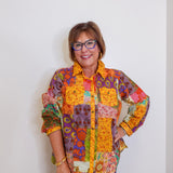 Woman wearing Ivy Jane patchwork top in multi-colored pattern
