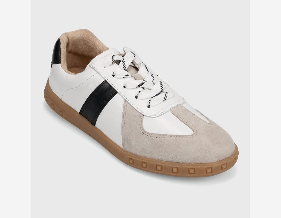 White and beige sneaker with a black stripe on a light gray background
