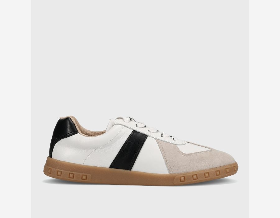 White sneaker with black and beige accents on a light gray background