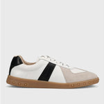White sneaker with black and beige accents on a light gray background