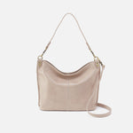 Beige handbag with a strap on a white background