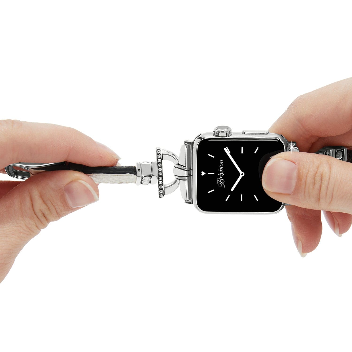 Person holding a unique watch design with a black face and silver case.