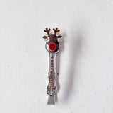 Spoon with reindeer design on a white background
