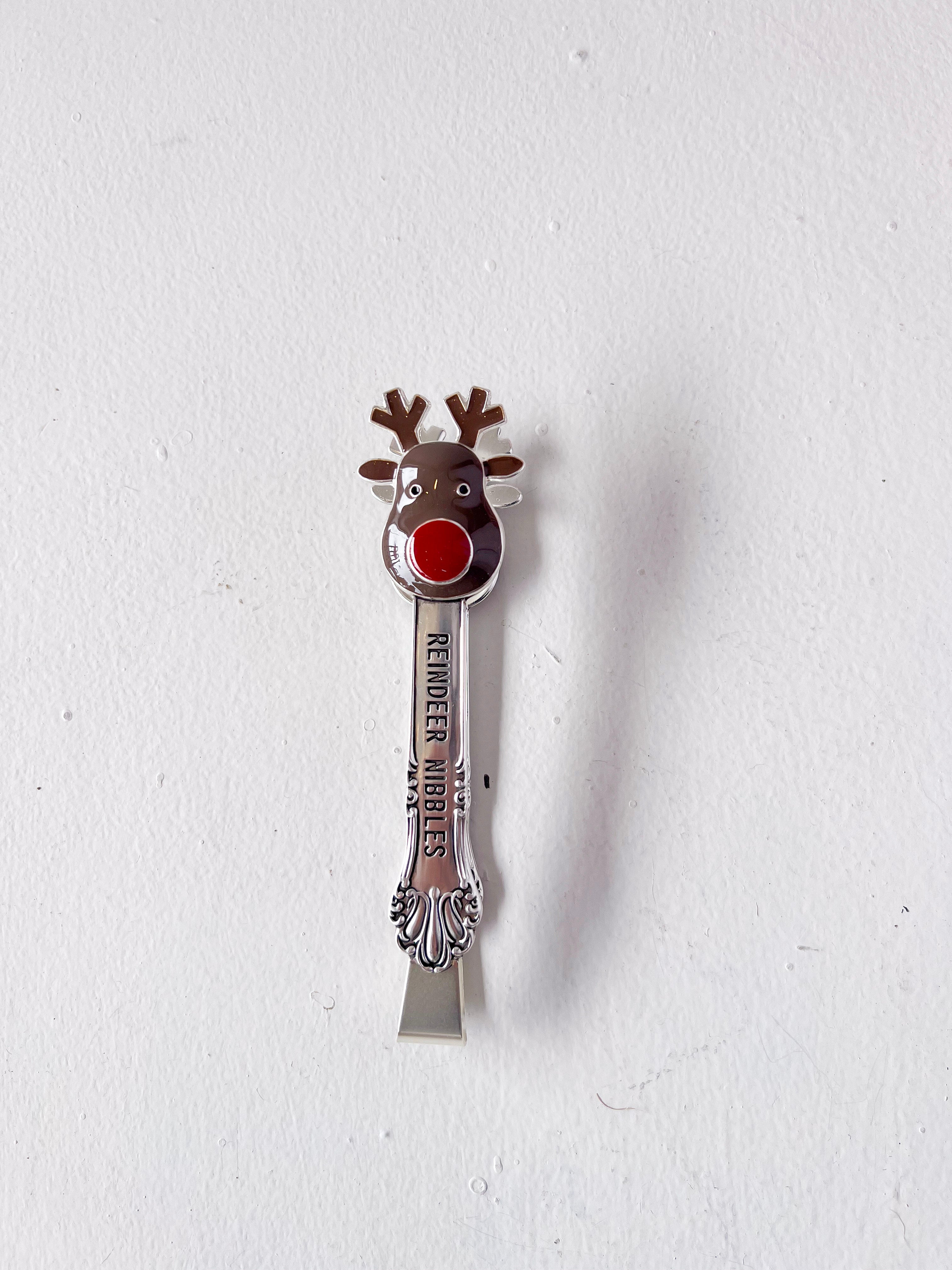 Spoon with reindeer design on a white background