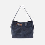 Blue handbag with a pocket on a white background