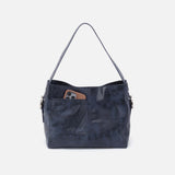 Blue handbag with a pocket on a white background