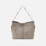 Gray handbag with a chain detail on a light gray background