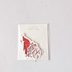 Pack of gift tags with a red and white design on a light gray background