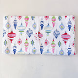 Flannel fabric with colorful Christmas ornament pattern on a white background