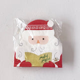 Packaged napkins with a Santa Claus design on a white background