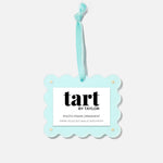 Decorative photo frame ornament with 'tart by Taylor' branding on a white background