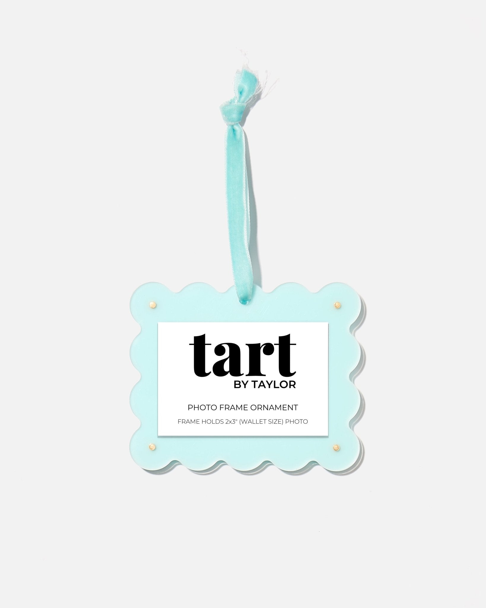Decorative photo frame ornament with 'tart by Taylor' branding on a white background