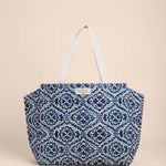 Blue patterned tote bag on a beige background
