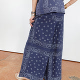 Person wearing a blue paisley patterned outfit on a white background