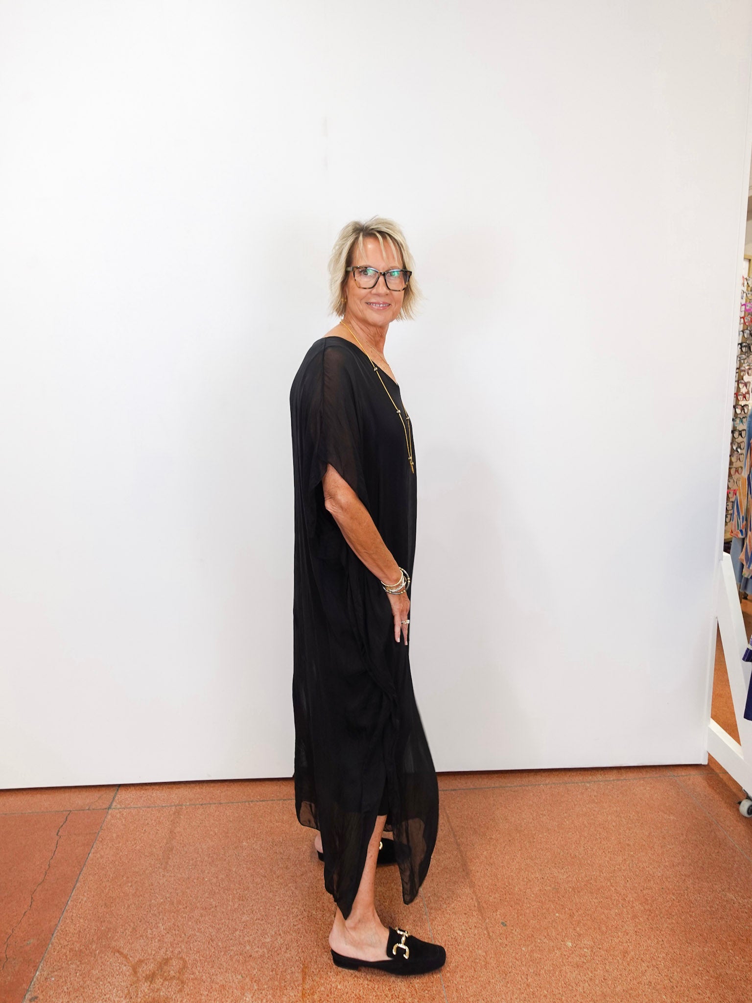 helen silk kaftan long dress in black featuring lightweight sheer fabric worn by model