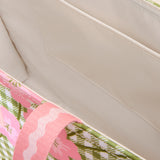 Close-up of a pink floral-patterned product on a beige surface