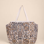 Floral patterned tote bag on a beige background