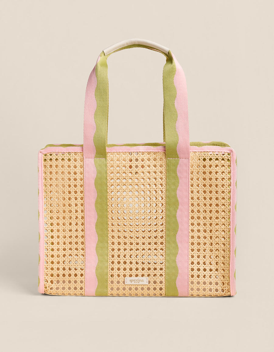 Woven tote bag with pink and green stripes on a beige background