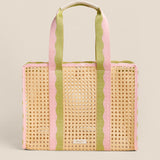Woven tote bag with pink and green stripes on a beige background