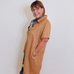 woman wearing a tribal front eyelet pockets suede dress