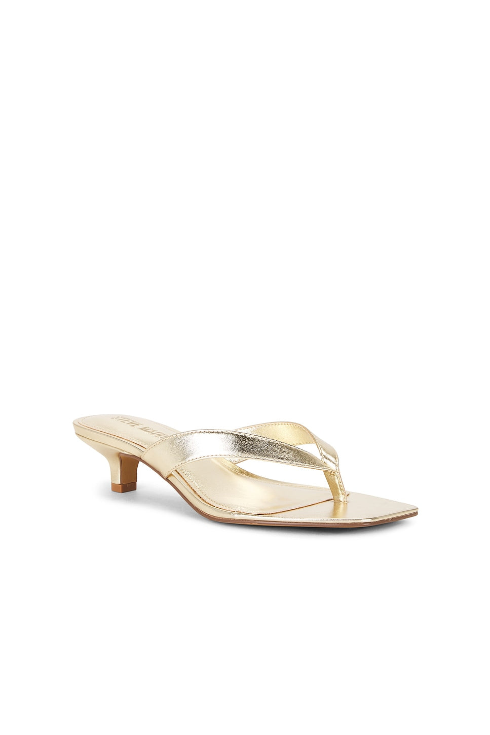 Gold high-heeled sandal on a white background