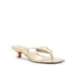 Gold high-heeled sandal on a white background