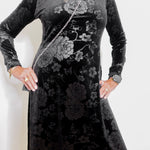 Black floral dress with long sleeves on a white background