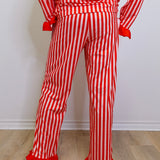 Red and white striped outfit with ruffled pants on a plain background
