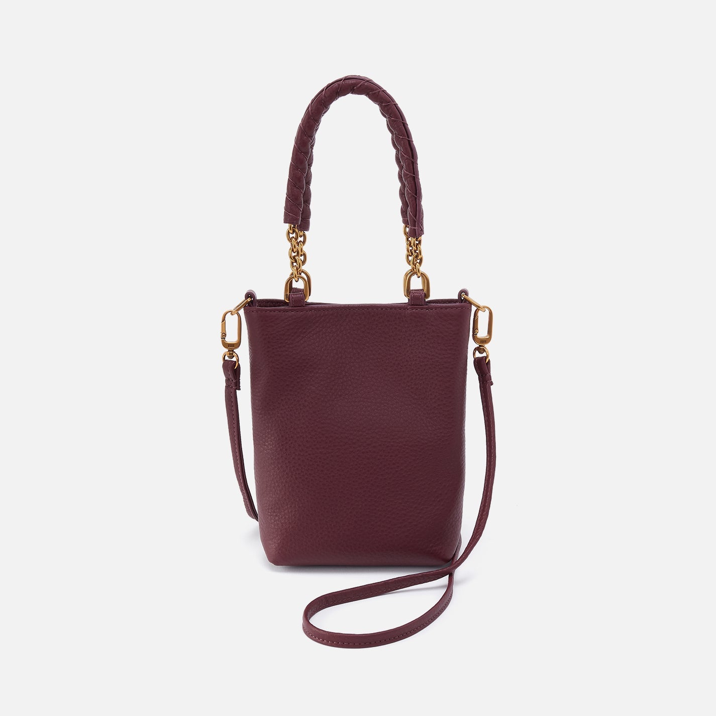 Burgundy handbag with gold accents on a white background