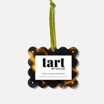 Tortoiseshell photo frame ornament with 'tart by Taylor' label on a white background