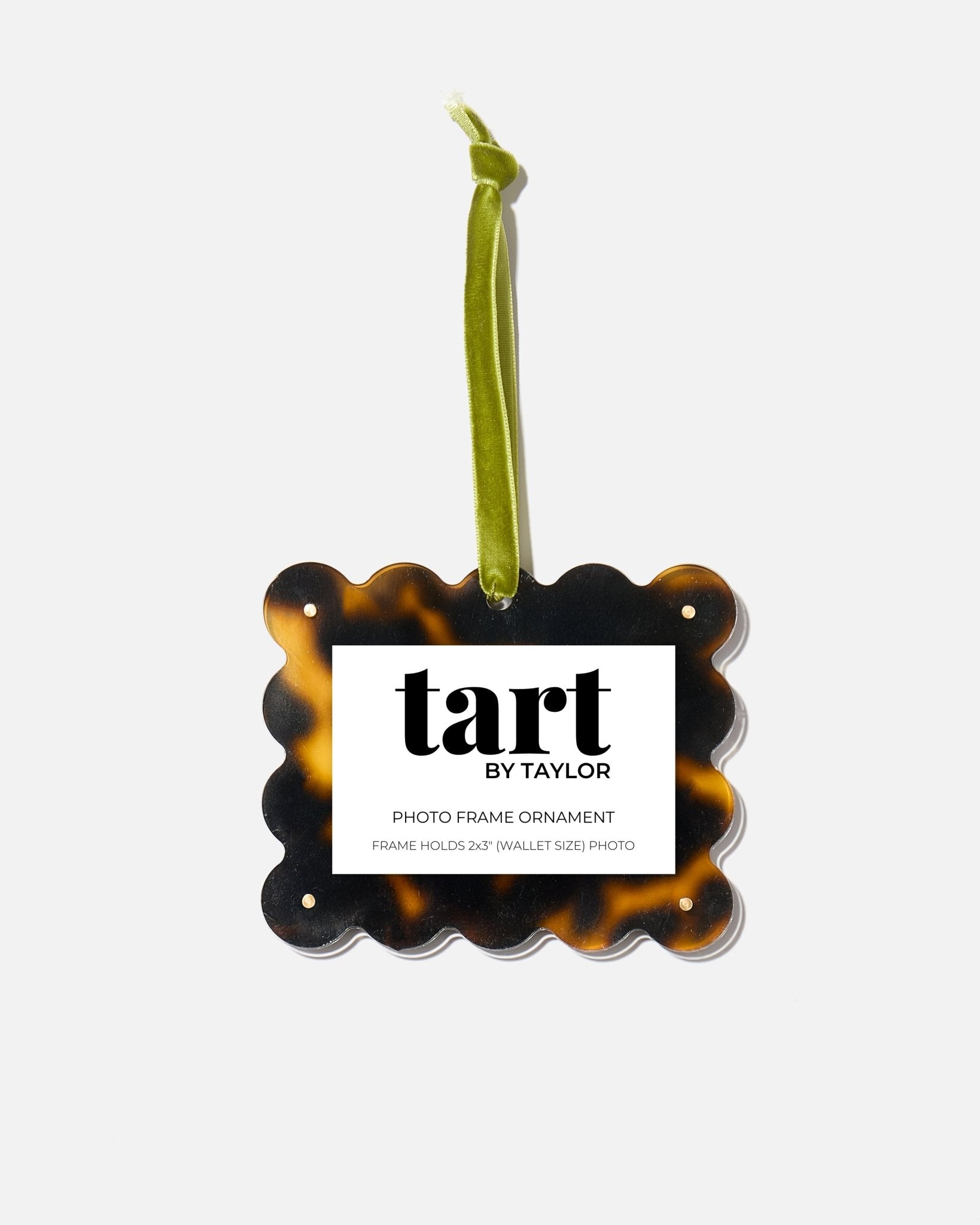 Tortoiseshell photo frame ornament with 'tart by Taylor' label on a white background