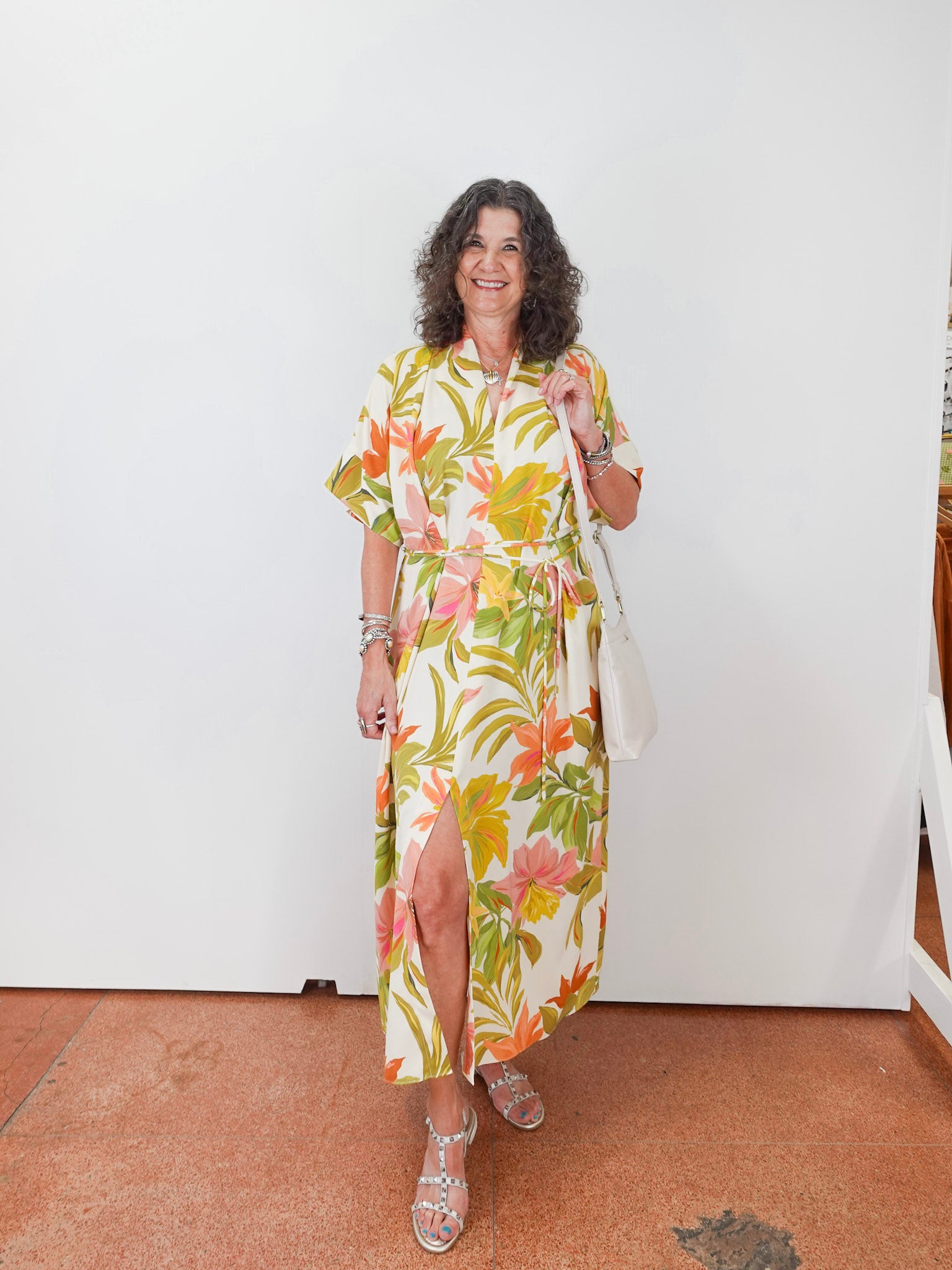 Woman wearing a floral dress with a white background