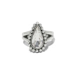 Silver ring with a teardrop-shaped gemstone on a white background