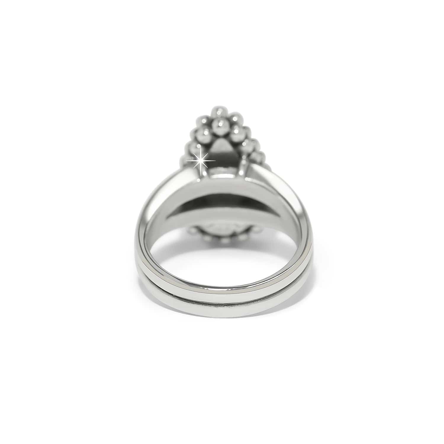 Silver ring with a central gemstone on a white background