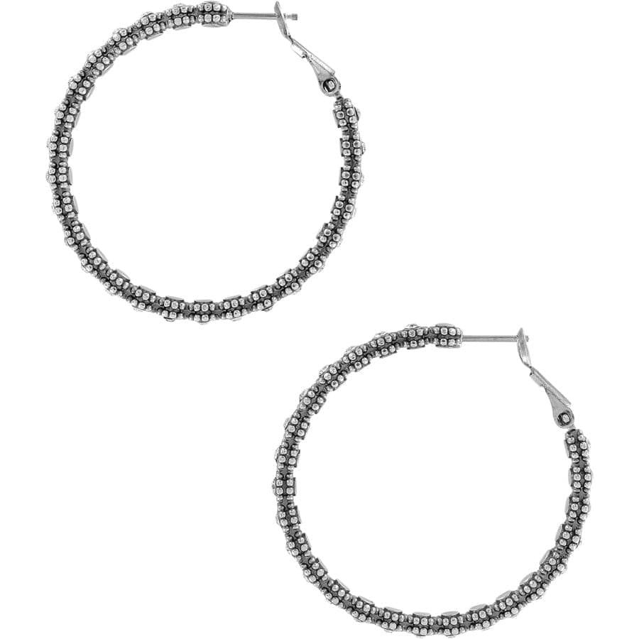 Pair of silver hoop earrings with beaded detailing on a white background