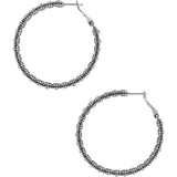 Pair of silver hoop earrings with beaded detailing on a white background