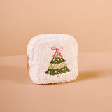White textured pouch with a Christmas tree design on a beige background