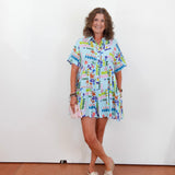 Woman wearing a colorful dress with a white background