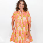 Woman wearing a floral dress on a white background